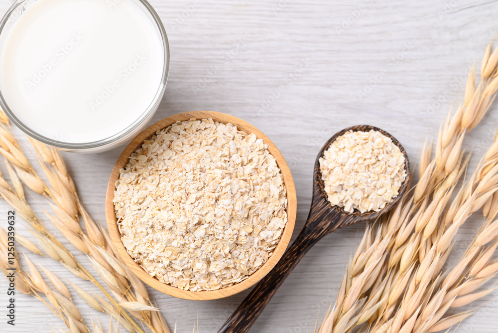 Oat flakes in bowl and oat milk on white background, Alternative milk made from plant, non dairy Oat flakes in bowl and oat milk on white background, Alternative milk made from plant, non dairy