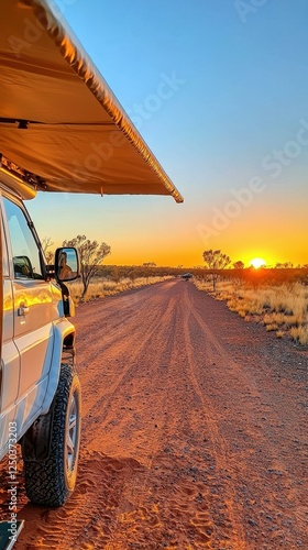 A scenic sunset along a dirt road adventure. photo