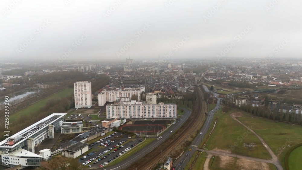 Fototapeta premium View of Amiens, France with Residential Buildings, Railway, and Green Spaces