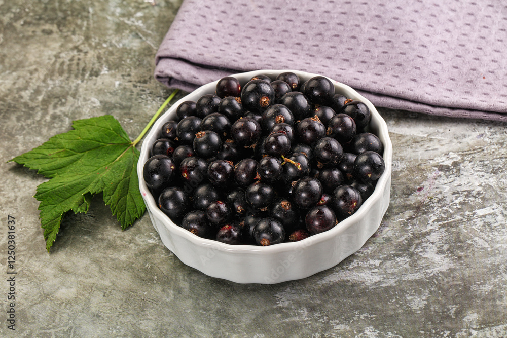 Ripe black currant in the bowl Ripe black currant in the bowl