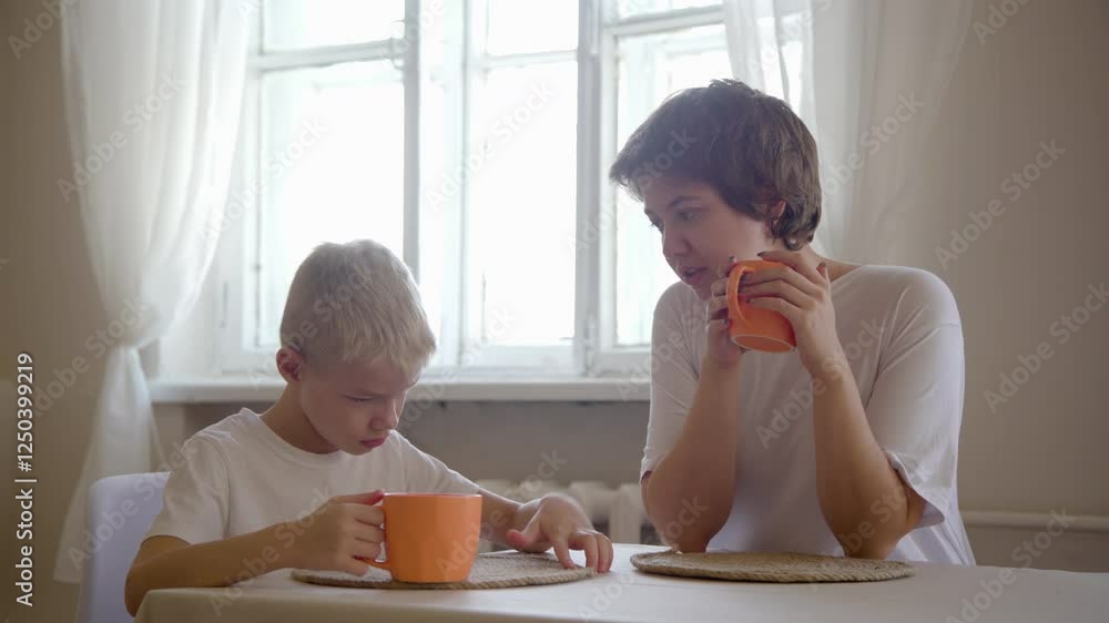 A loving mother and her young son enjoy quality time at home, playing and engaging in fun sports activities. The video captures family love, daily routines, joy, and bonding in a warm, cozy atmosphere A loving mother and her young son enjoy quality time at home, playing and engaging in fun sports activities. The video captures family love, daily routines, joy, and bonding in a warm, cozy atmosphere