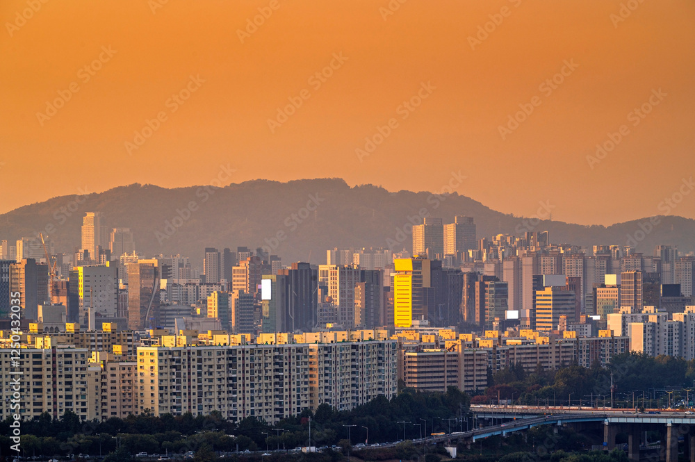 Seoul cityscapes, skyline, high rise office buildings and skyscrapers with blue sky and cloud in Seoul city, winter daylight, top view in winter, Seoul, Republic of Korea,.