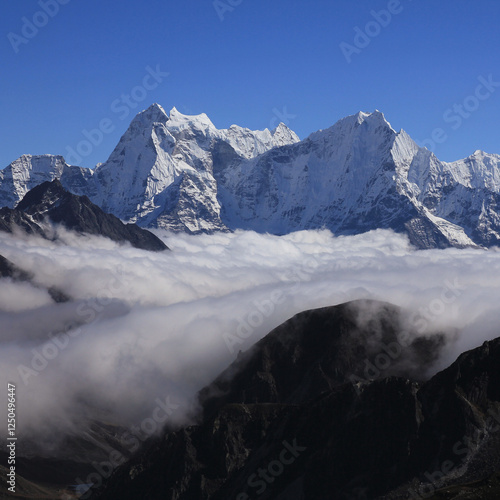 Sea of fog and high mountains Kangtega and Thamserku, Nepal. photo