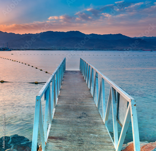 Night scene on a public beach of the Red Sea, foreground with footpath for sa...