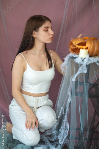 Young pretty brunette celebrating Halloween photo