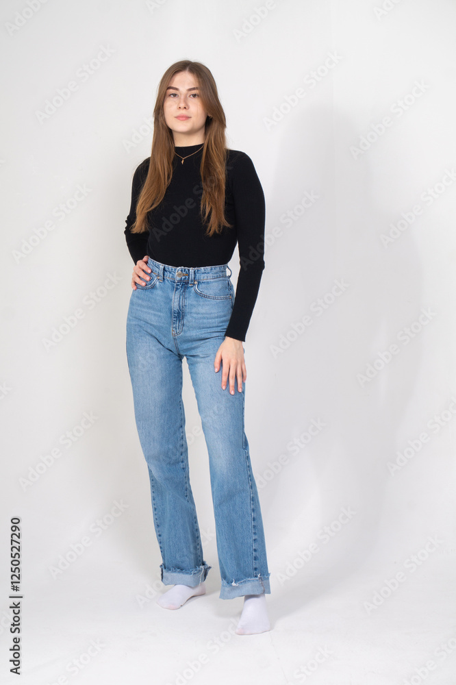 Cute young brunette standing on a white background Cute young brunette standing on a white background