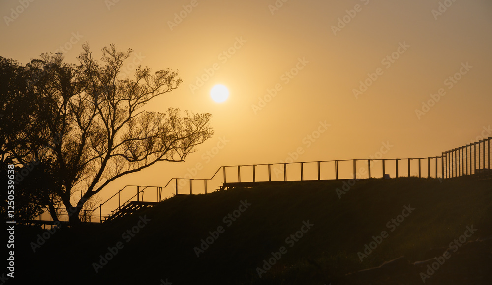 Sun rising above Mt Eden summit. Auckland.