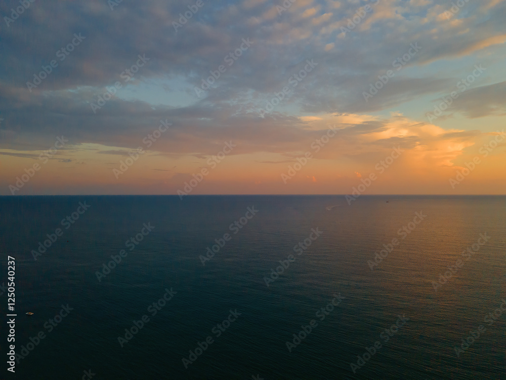Panoramic view of the sea from a height against the sky at sunset Panoramic view of the sea from a height against the sky at sunset