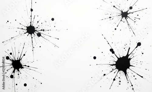 Black ink splatters on a white background photo