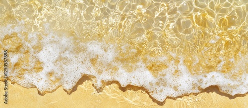 Fototapeta Naklejka Na Ścianę i Meble -  Transparent sea water gently lapping over smooth yellow sand beach creating a tranquil and serene coastal scene in Puglia Italy