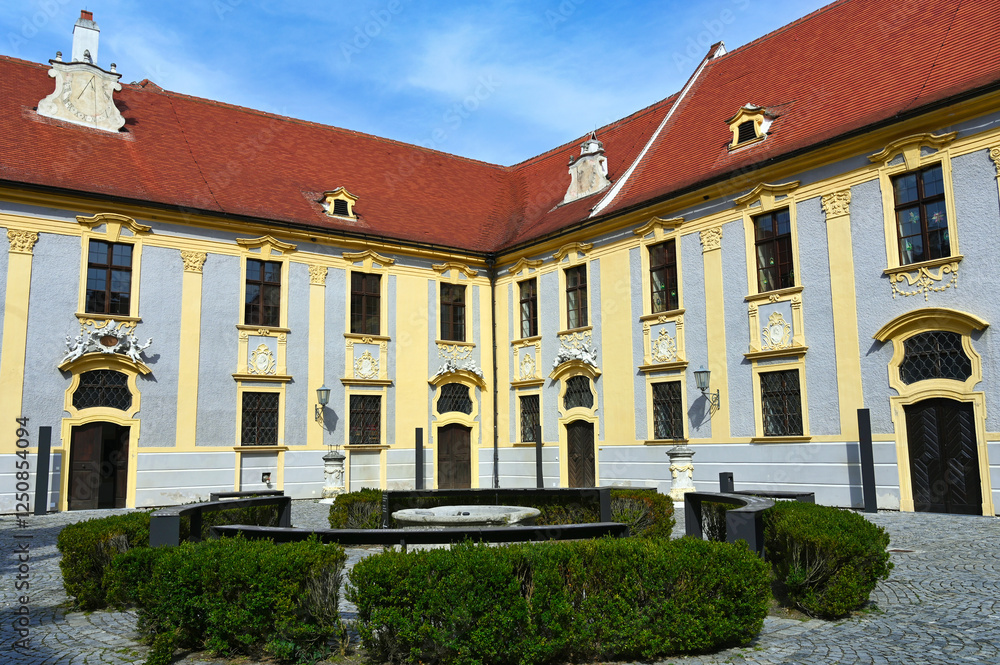 Fototapeta premium Courtyard of Mariahimmelfahrt church in the village of Durnstein in Wachau Valley, Austria