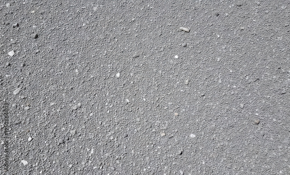 Close-up of textured gray asphalt surface Close-up of textured gray asphalt surface
