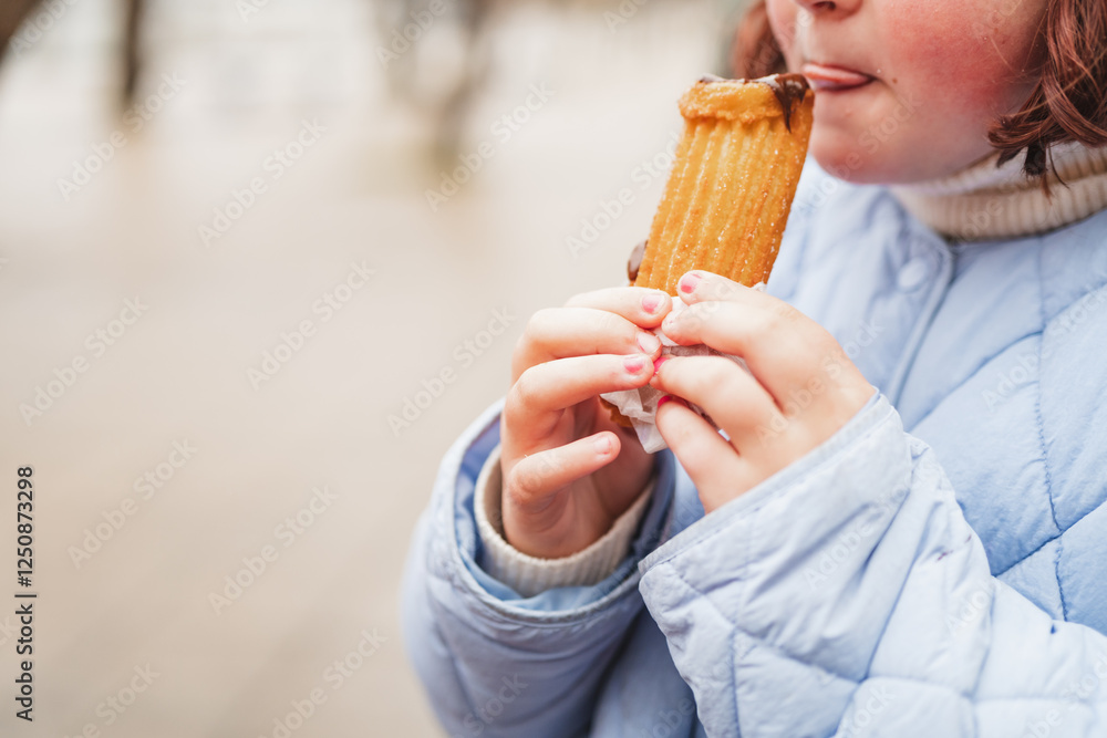 Enjoying freshly fried fritters on a chilly day while wrapped in comfort and warmth Enjoying freshly fried fritters on a chilly day while wrapped in comfort and warmth