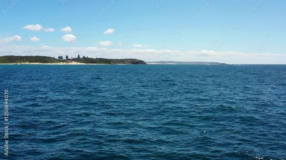 Low scenic panorama of Caves beach Pacific coast of Australia from open sea 4k.
Low scenic panorama of Caves beach Pacific coast of Australia from open sea 4k.
