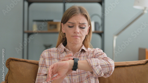 Portrait of WAiting Young Woman Checking Time on Smartwatch