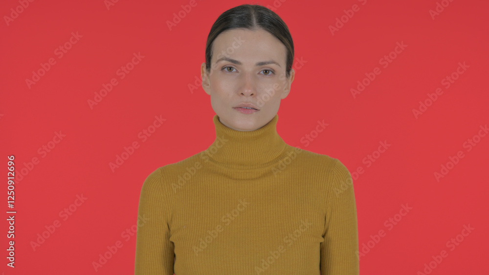 Fototapeta premium Serious Casual Young Woman on Red Background, Portrait