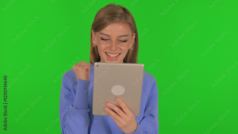 Woman Celebrating Success on Tablet on Green Background Woman Celebrating Success on Tablet on Green Background