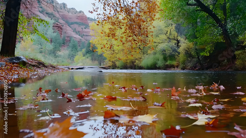 Autumn leaves on the river, scenic Sedona, Arizona. Tranquil nature scene. Great for travel blogs, websites, or inspirational desktop wallpaper