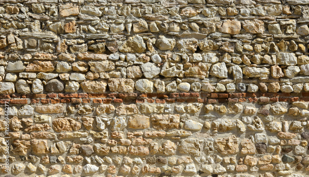 background of wall and many old stones ideal as a rough backdrop background of wall and many old stones ideal as a rough backdrop