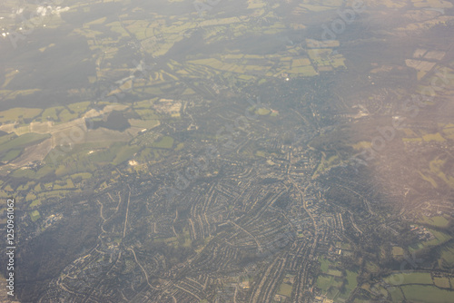 Obraz na płótnie Aerial view of London outskirts lush green fields from an aeroplane window w salonie