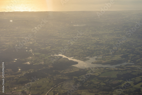 Obraz na płótnie Aerial view of London outskirts lush green fields from an aeroplane window w salonie