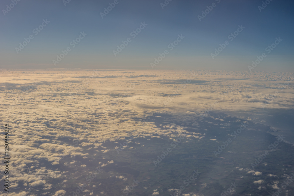 Aerial view of morning clouds at golden hour sunrise through the clouds