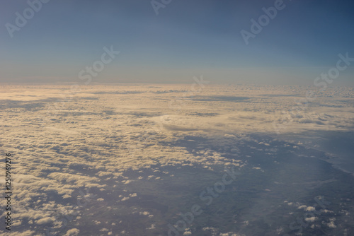 Aerial view of morning clouds at golden hour sunrise through the clouds