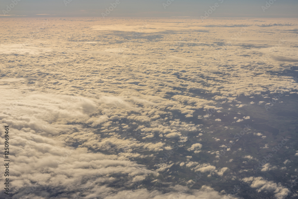 Aerial view of morning clouds at golden hour sunrise through the clouds