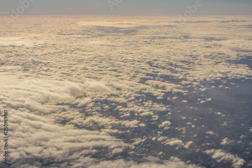 Obraz na płótnie Aerial view of morning clouds at golden hour sunrise through the clouds w salonie