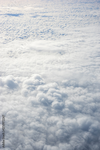 Obraz na płótnie View of clouds from airplane window, clouds in a blue sky w salonie
