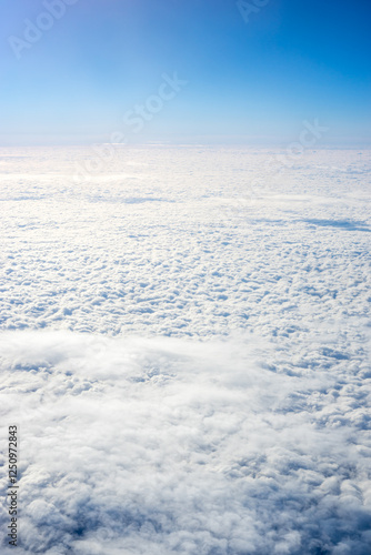 Obraz na płótnie View of clouds from airplane window, clouds in a blue sky w salonie