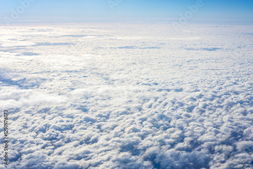 Obraz na płótnie View of clouds from airplane window, clouds in a blue sky w salonie