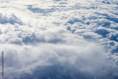 Obraz na płótnie View of clouds from airplane window, clouds in a blue sky w salonie