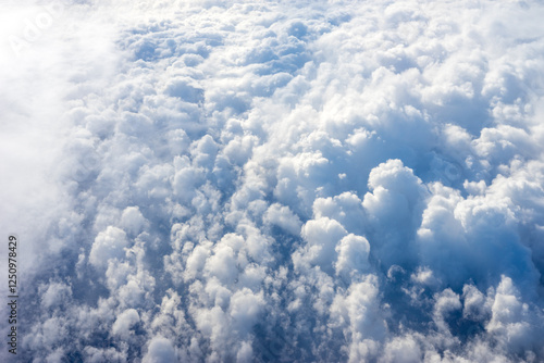 Obraz na płótnie View of clouds from airplane window, clouds in a blue sky w salonie