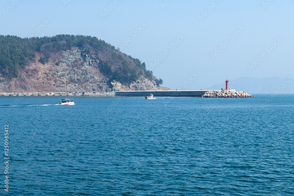 speed boat and lighthouse at the harbor speed boat and lighthouse at the harbor