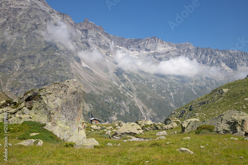 The valley under Monte Rosa and Punta Gnifetti paks and the Rifugio Zambon Zappa chalet  - Valle Anzasca valley. photo