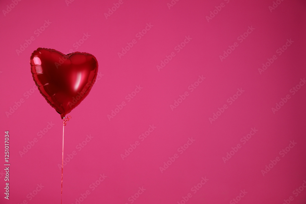 Heart-shaped red balloon on pink background, space for text. Valentine's day Heart-shaped red balloon on pink background, space for text. Valentine's day