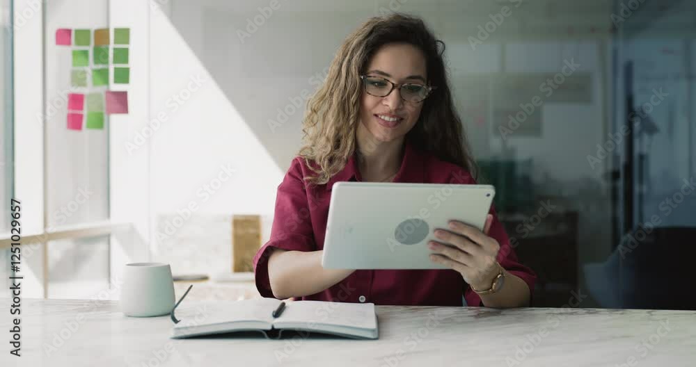Businesswoman sits at desk with cup and personal organizer lead chat on digital tablet, responding on business emails, check social media platform for marketing purposes, review project plans or tasks Businesswoman sits at desk with cup and personal organizer lead chat on digital tablet, responding on business emails, check social media platform for marketing purposes, review project plans or tasks