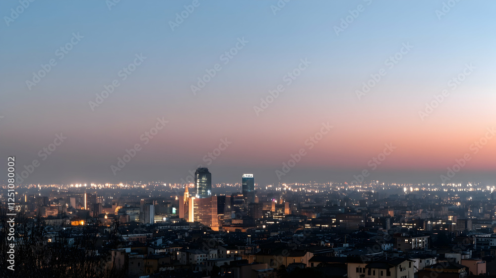 Obraz premium City view at dusk. Night lights illuminate buildings as the sun sets. Use for travel brochures or city guides