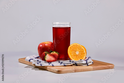 Strawberry, apple, orange mix with soft drink decorate with surrounding fruit.