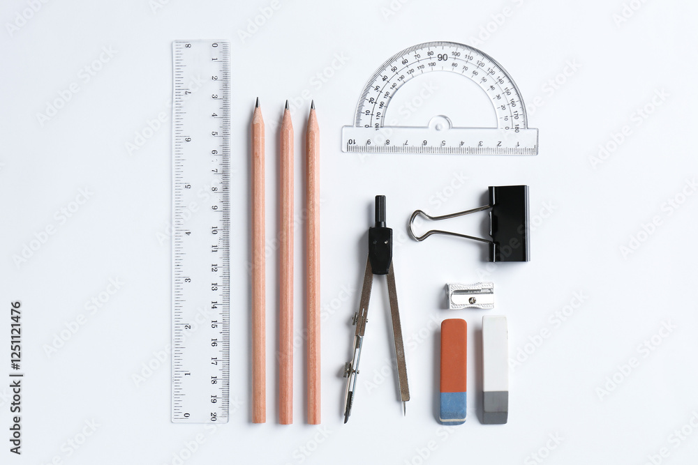 Flat lay composition with ruler and other stationery on white background Flat lay composition with ruler and other stationery on white background