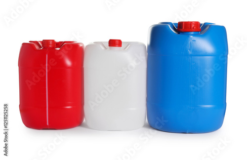 Three colorful plastic canisters isolated on white photo