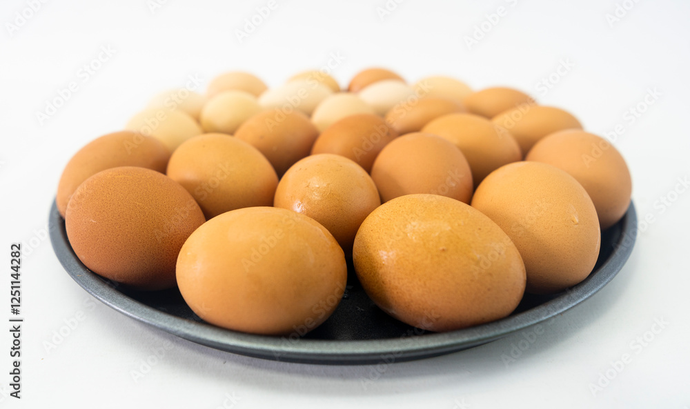 Light brown chicken eggs with slight variations Light brown chicken eggs with slight variations