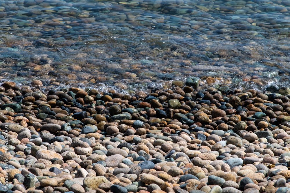 surf and wave on the pebble beach