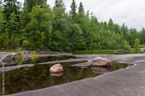 Wallpaper Mural Stone plateau with large boulders and puddles of water after rain. White Sea petroglyphs archeological site, Zalavruga, Belomorsk, Karelia, Russia Torontodigital.ca