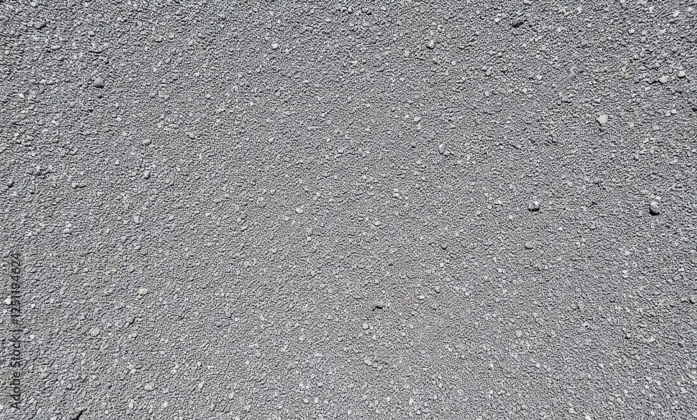 Close-up of textured gray asphalt Close-up of textured gray asphalt