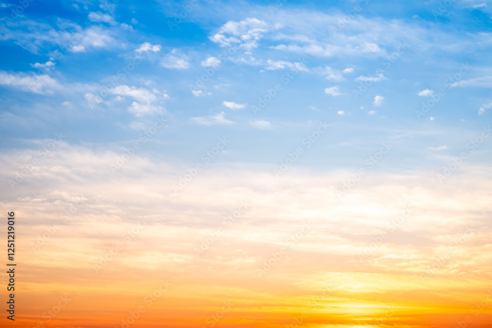 Fototapeta premium Beautiful , luxury soft gradient orange gold clouds and sunlight on the blue sky perfect for the background, take in evening,Twilight, Large size, high definition landscape photo