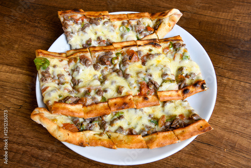 Kiymali pide.Turkish pide with minced meat. Turkish pizza mince pita Pide on white . Etli ekmek.Kusbasi kasarli, kiymali kasarli, kiymali yumurtali, Bafra, Trabzon, Kusbasili pide. Urfa acili lahmacun photo