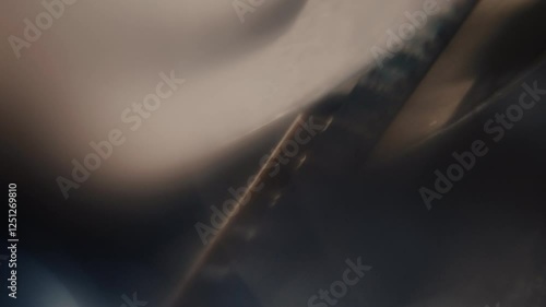 Close ups of a vintage 8MM projector spools moving and playing film 