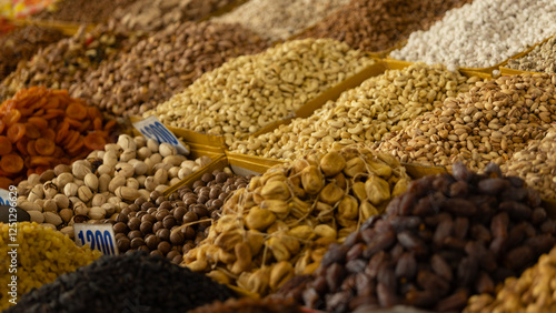 a basket of dried nut, fruit and almond in Osh Bazaar at Bishkek, Kyrgyzstan.  photo